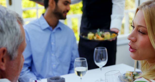 People Socializing and Enjoying Meal in Restaurant - Download Free Stock Images Pikwizard.com