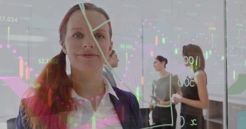 Business team analyzing data with transparent financial overlay