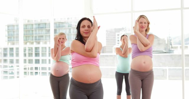 Pregnant Women Practicing Yoga in Bright Studio - Download Free Stock Images Pikwizard.com