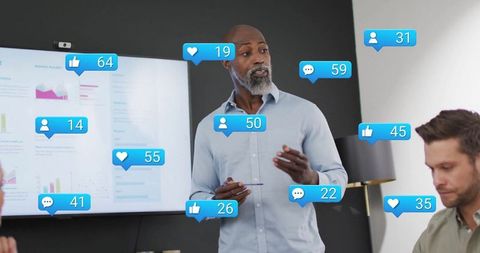 Business Team Interacting with Social Media Icons in Modern Multiracial Office