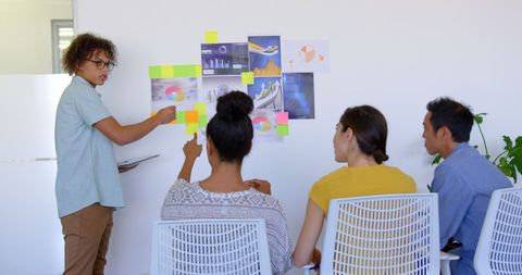 Diverse Team Engaged in Collaborative Office Presentation