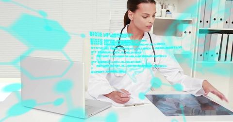 Doctor reviewing medical scan on tablet with futuristic data overlay