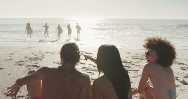 Friends Enjoying Beach Together Under Summer Sun - Download Free Stock Images Pikwizard.com