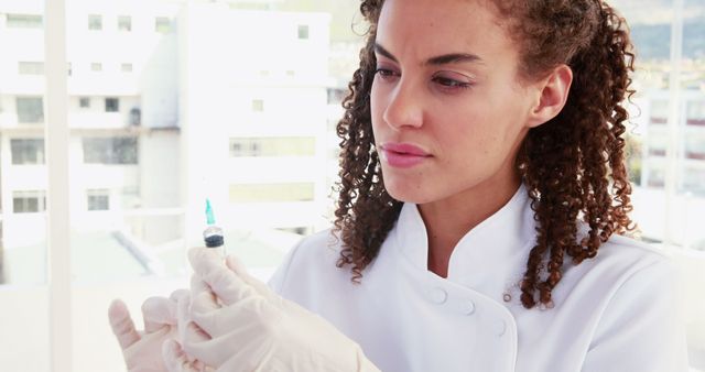 Doctor Holding Syringe for Vaccination in Medical Clinic - Download Free Stock Images Pikwizard.com