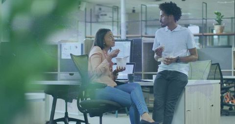 Diverse Coworkers Chatting During Break at Modern Office