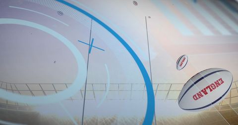 Rugby balls with england print falling in sports stadium