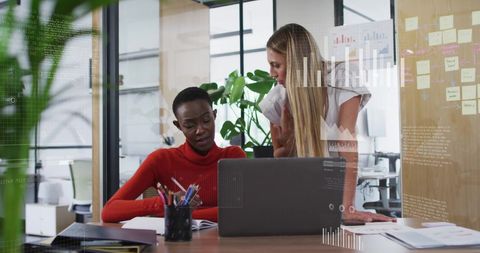 Businesswomen Collaborating on Tech Project in Modern Office - Download Free Stock Images Pikwizard.com