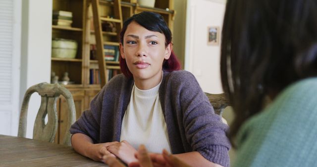 Young Woman Having Serious Conversation at Home - Download Free Stock Images Pikwizard.com