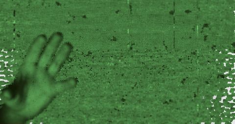 Night vision horror theme with mysterious hand