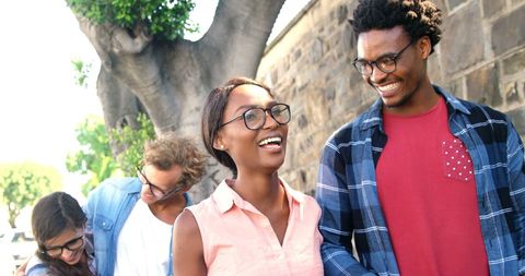 Joyful Young Adults Enjoying Time Outdoors in Friendly Atmosphere