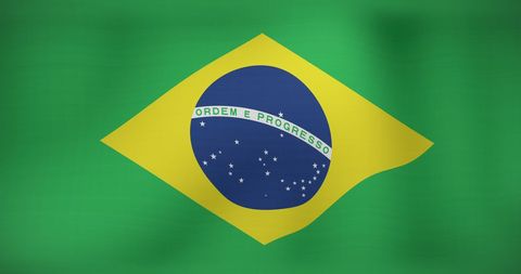 Brazilian Flag Waving in the Wind with Green Background