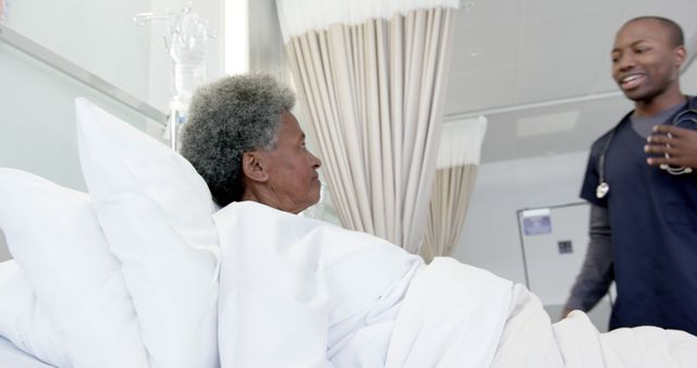 Nurse Communicating with Elderly Patient in Hospital Room - Download Free Stock Images Pikwizard.com