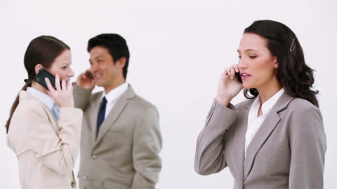 Business Professionals Engaged in Mobile Conversations