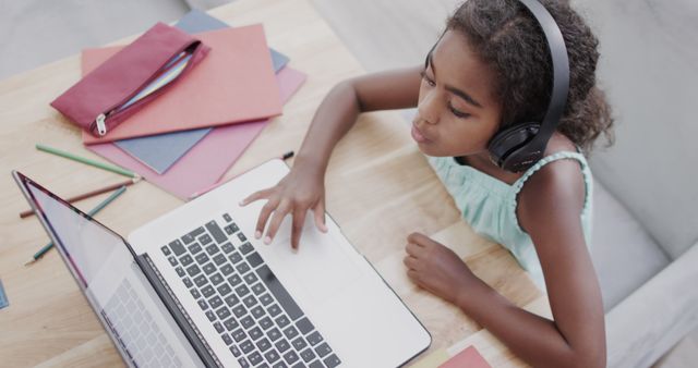 Young Girl Studying Online with Laptop and Headphones at Home - Download Free Stock Images Pikwizard.com