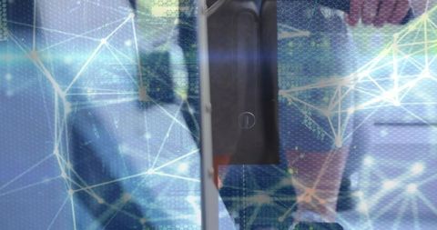 Woman reflecting on elevator panel holding smartphone with holographic network overlay