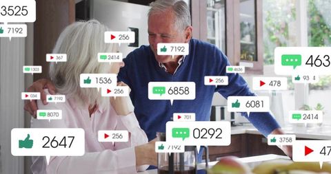 Elderly couple sharing warm kitchen moment with floating social media engagement