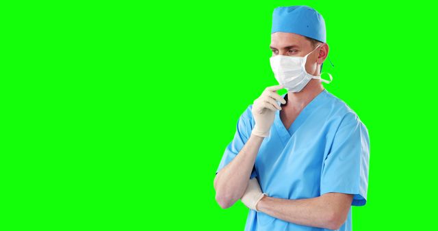 Male Surgeon in Scrubs and Gloves Contemplating - Download Free Stock Images Pikwizard.com