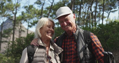 Senior Couple Enjoying Hike in Sunny Mountain Forest - Download Free Stock Images Pikwizard.com