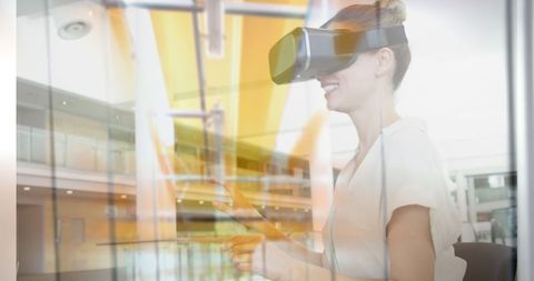 Woman Experiencing Virtual Reality in Modern Workspace - Download Free Stock Images Pikwizard.com