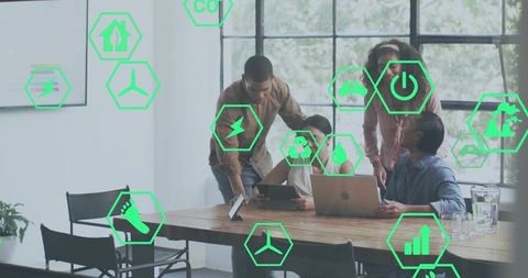 Team Collaborating on Greentech Strategy with Sustainability Icons Overlay