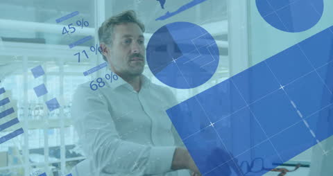 Businessman Analyzing Financial Data Visualization in Modern Office