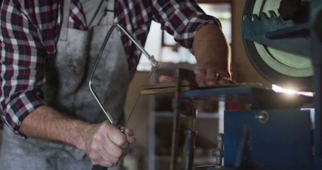 Craftsman Using Bandsaw in Carpentry Workshop - Download Free Stock Images Pikwizard.com