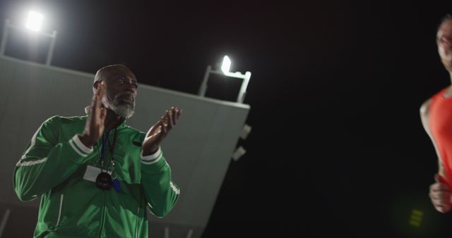 Athletic Coach Encouraging Athlete During Night Training Session - Download Free Stock Images Pikwizard.com