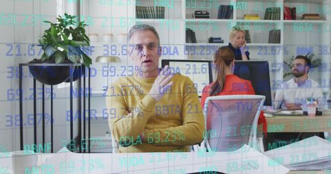 Office Team Analyzing Digital Data with Futuristic Interface