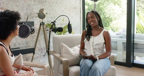 African American Women Recording Cozy Home Podcast Interview with Microphone and Tablet