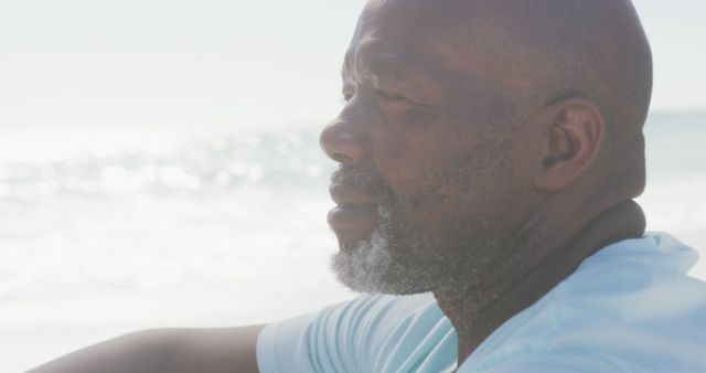 Pensive Man Reflecting While Sitting on Beach - Download Free Stock Images Pikwizard.com