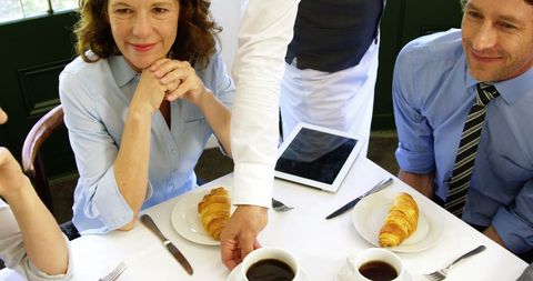 Business Colleagues Engaging Meeting in Restaurant Ambience