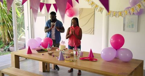 Couple declaring celebration prayer at birthday party