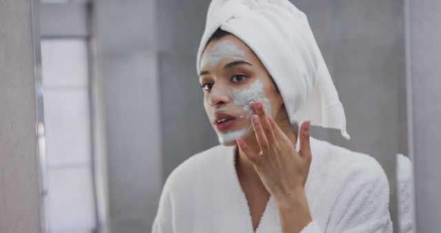 Young Woman Applying Green Face Mask in Bathroom - Download Free Stock Images Pikwizard.com