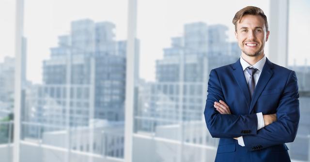 This image depicts a confident businessman standing with his arms crossed in a modern office setting. It is suitable for use in corporate presentations, business websites, promotional materials, and articles related to business success, leadership, and professionalism.