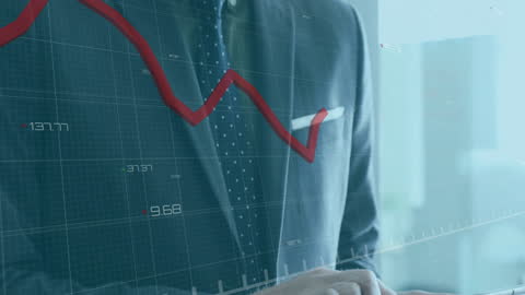 Businessman Analyzing Financial Data on Tablet in Futuristic Setting