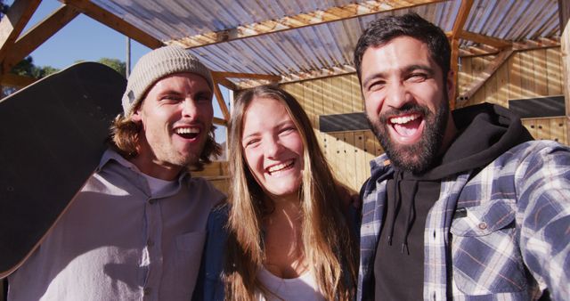 Group of Happy Friends Laughing Outdoors in Sunny Weather - Download Free Stock Images Pikwizard.com