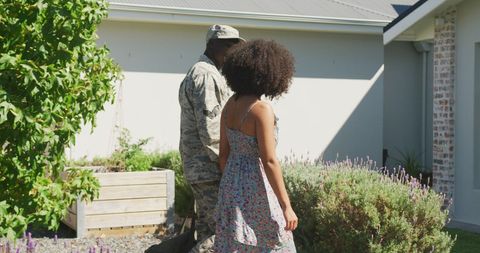 Reunited Soldier with Family at Home Garden