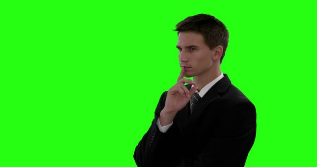 Young Professional Contemplating Against Green Screen Background - Download Free Stock Images Pikwizard.com