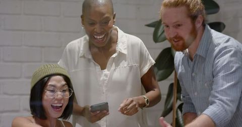 Diverse Team Collaborating on Innovative Business Project in Office