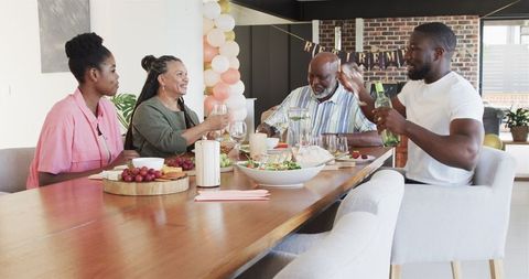 Family Celebrating Retirement with Shared Meal