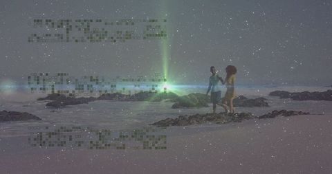 Couple Walking on Rocky Beach at Dusk with Starry Sky