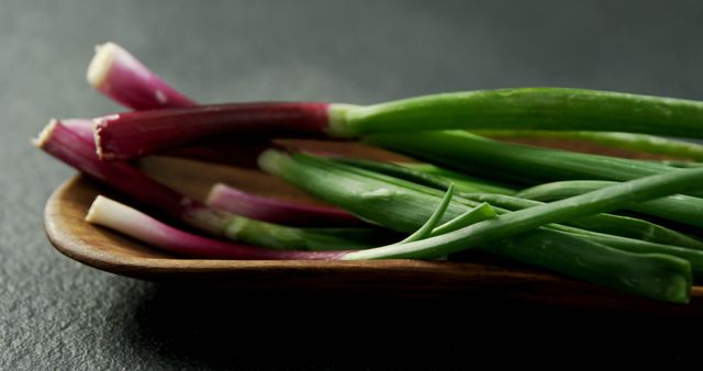 Fresh Green and Red Spring Onions on Wooden Plate - Download Free Stock Images Pikwizard.com
