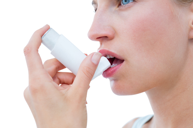 Blonde Woman Using Transparent Asthma Inhaler Close Up - Download Free Stock Videos Pikwizard.com