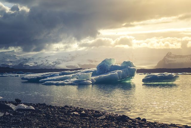 Majestic Icebergs Floating in Tranquil Arctic Waters During Sunset - Download Free Stock Photos Pikwizard.com