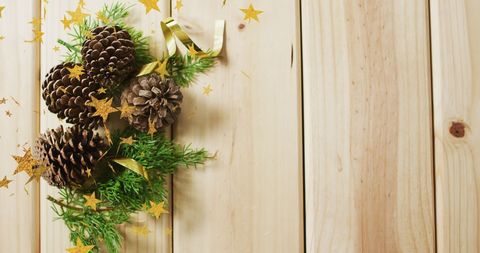 Pine Cones and Evergreens with Golden Stars for Christmas Celebration - Download Free Stock Images Pikwizard.com