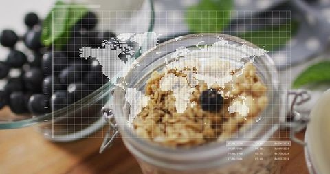 Granola jar topped with dark berry, world map overlay for global food health concept