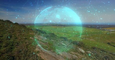 Digital Globe Hologram Above Scenic Farmland Landscape