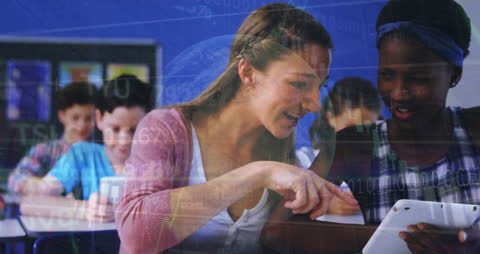 Tutor Teaching Student with Tablet in Technology-Focused Classroom