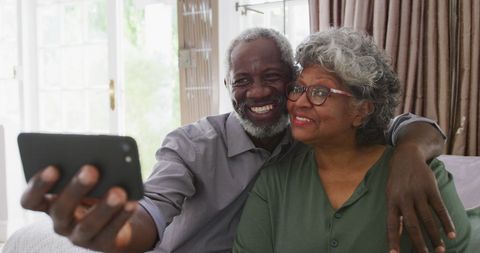 Senior Couple Taking Selfie Together at Home