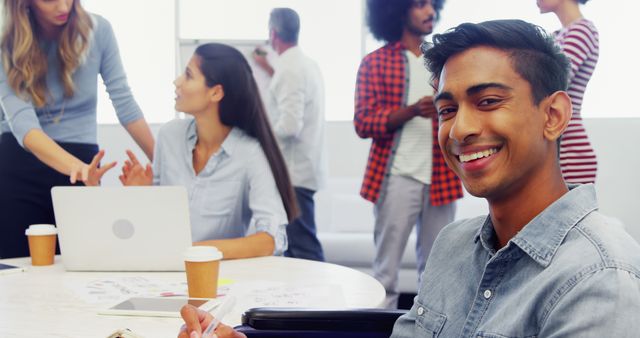 Diverse Office Meeting with Happy Employees Collaborating and Smiling - Download Free Stock Images Pikwizard.com